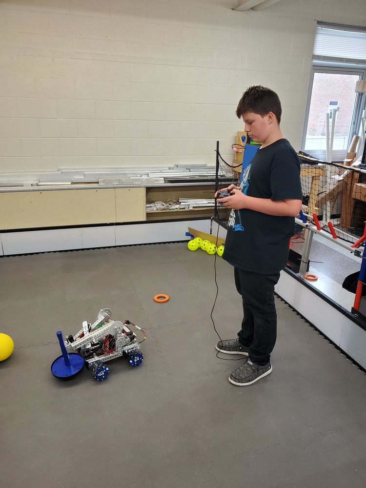 Zayne H trying out one of last year's robots